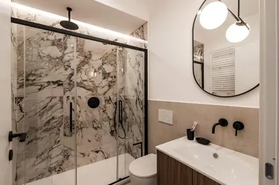 a bathroom with a shower and a sink at The Best Rent - Spacious three-bedroom flat in the San Giovanni area in Rome