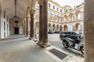 a car parked in front of a building at Palazzo Borghese, a Burghesius home in Rome