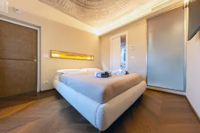 a bedroom with two beds in a room at Restart Accommodations Colonna e Ludovisi in Rome