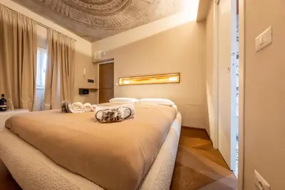a bedroom with a large bed in a room at Restart Accommodations Colonna e Ludovisi in Rome