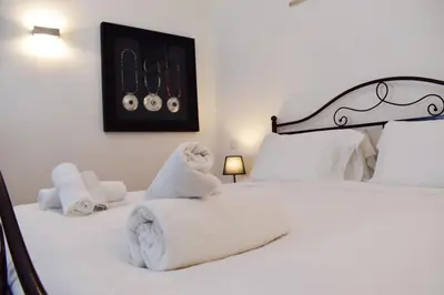 a bedroom with two beds with white towels on them at Appartamento a Piazza Navona in Rome
