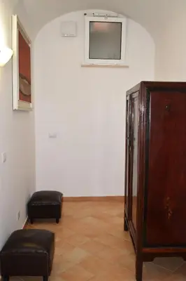 a room with a dresser and a tv on a wall at Appartamento a Piazza Navona in Rome