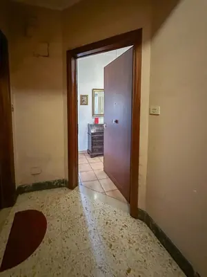 an empty hallway with a door and a room at Marta Suite - Metro Malatesta & Wi-Fi in Rome