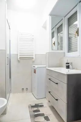 a bathroom with a sink and a toilet and a shower at Lion Renting Marconi in Rome