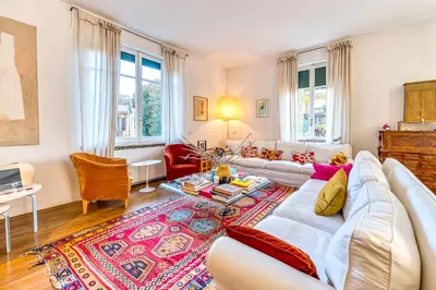 a living room with a couch and a table at Skylife Eco-Luxe Trastevere Haven in Rome