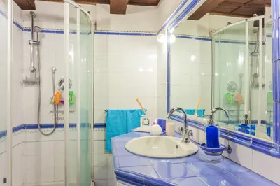 a bathroom with a sink and a shower at Loft Trastevere 2 floors in Rome