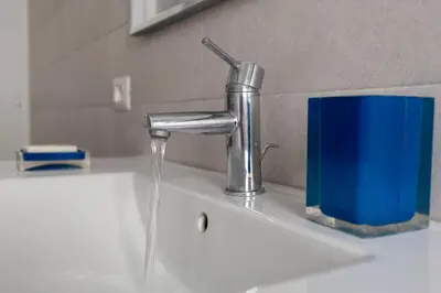 a sink with water coming out of a faucet at Aura in Rome
