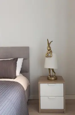 a lamp on a night stand next to a bed at Aura in Rome