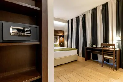 a bedroom with a bed and a desk in a room at Chic&Town Luxury Rooms Piazza del Popolo in Rome