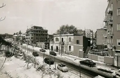 a black and white photo of a snow covered city at Borgo Felix - Authentic Roman Living in Quadraro in Rome