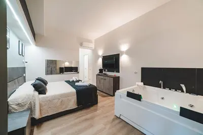 a bedroom with a bed and a bath tub at Monteverde Vatican in Rome