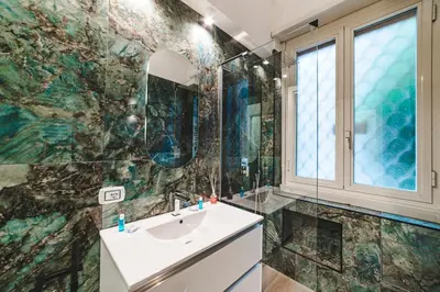 a bathroom with a sink and a mirror at Monteverde Vatican in Rome