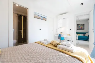 a bedroom with a bed with towels on it at Boutique Domus Trastevere Penthouse in Rome