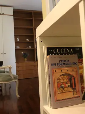 a book sitting on a shelf in a room at Due Calzini in Rome
