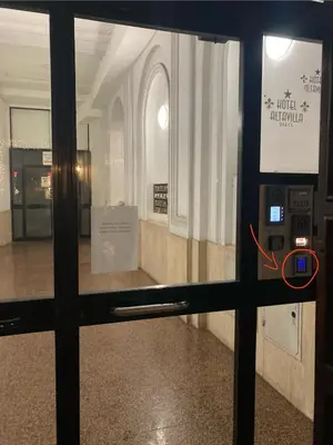a view through a window of a room with a ticket machine at Principe Amedeo piano terra in Rome