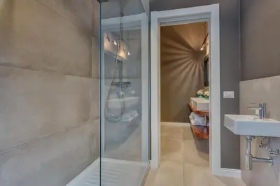 a bathroom with a shower and a sink at RomExperience Borgo Pio in Rome