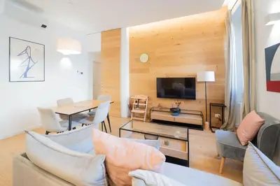a living room with a couch and a table at Barbra Suite Testaccio in Rome