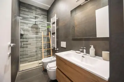 a bathroom with a sink and a toilet at Barbra Suite Testaccio in Rome