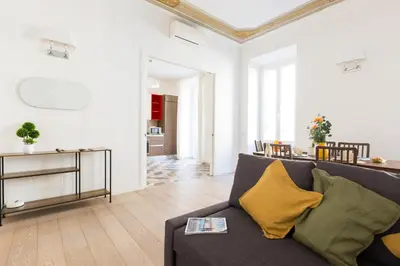 a living room with a couch and a table at Quiet retreat in Trastevere - ZENO 45 in Rome