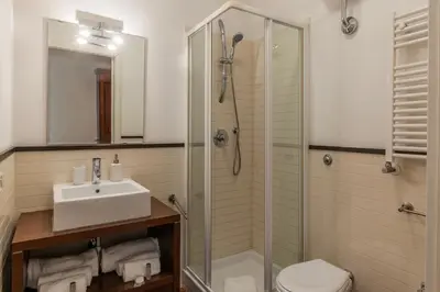 a bathroom with a shower and a sink and a toilet at Piazza Alessandria - FromHometoRome in Rome