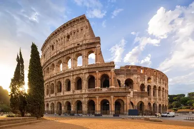 a view of the colosseum at sunset at A Casa di Mario al Pigneto in Rome