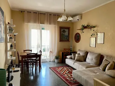 a living room with a couch and a table at MyHomeinRome - Zona Re di Roma in Rome