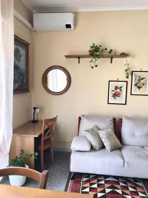 a green bedroom with a bed and two lamps at MyHomeinRome - Zona Re di Roma in Rome