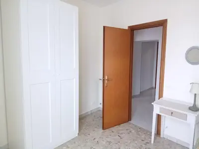 an empty room with a door and a white wall at WelcHomeRome in Rome