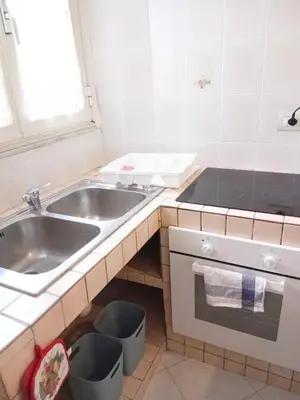 a small kitchen with a sink and a sinkiterator at WelcHomeRome in Rome