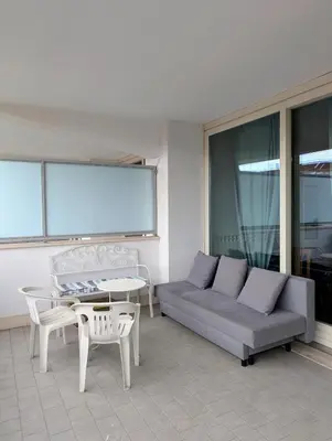 a living room with a couch and a table at Porta Portese Trastevere Bright New Apartment in Rome