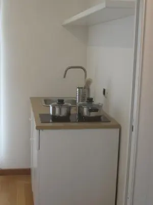a kitchen with a sink with two pots on it at Penthouse in Trastevere - Entire House in Rome