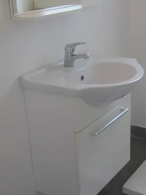 a white sink in a bathroom with a mirror at Penthouse in Trastevere - Entire House in Rome