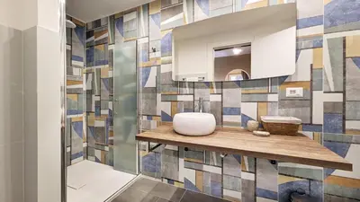 a bathroom with a sink and a mirror at DolceVite - Piazza Di Spagna in Rome