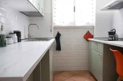 a kitchen with a sink and a counter top at Funky 3BR Flat, Scenic Tram to Colosseum 7 Stops in Rome