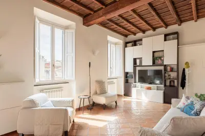a living room with two couches and a tv at iFlat Trevi Charm, Elegant & Comfy Roman Escape in Rome