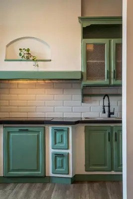 a kitchen with green cabinets and a sink at Casa Matilde - WelcomeToRhome in Rome