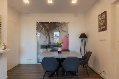 a dining room with a table and four chairs at Casa Matilde - WelcomeToRhome in Rome
