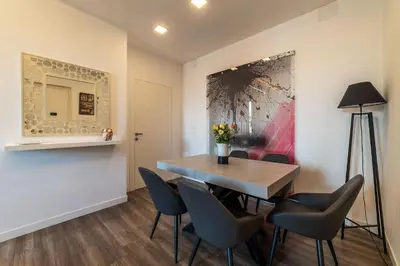 a dining room with a table and chairs at Casa Matilde - WelcomeToRhome in Rome