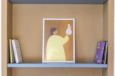 a picture of a woman holding a tea pot on a shelf at iFlat Vatican New & Comfy Sunlit Apartment in Rome