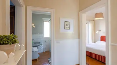 a hallway leading to a bedroom with a bed at Vatican Park Residence in Rome