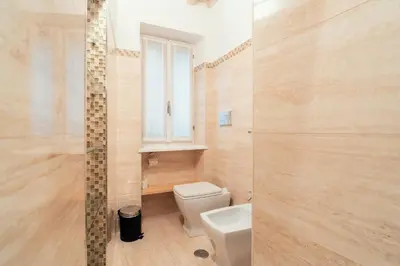a hallway with a wooden floor and a door at Majorelle comfy apartment in Rome