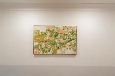 a painting of palm trees on a white wall at Domus 44 Apartment in Rome