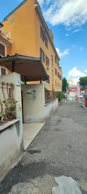 a building on the side of a street at Domus 44 Apartment in Rome