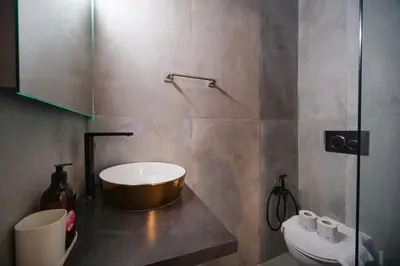 a bathroom with a tub and a toilet at Trident Suite by BuddyRent in Rome