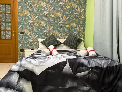 a bedroom with a bed with stuffed animals on it at Colosseum Star Guest House in Rome