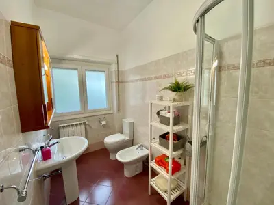 a bathroom with a sink and a toilet and a shower at Mary's Apartment - House for 4 people - Close to the Vatican in Rome