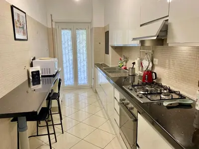 a kitchen with a stove and a counter top at Mary's Apartment - House for 4 people - Close to the Vatican in Rome