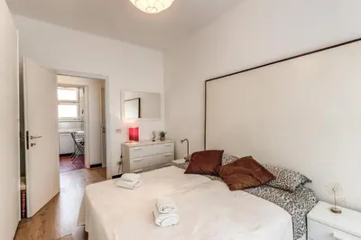a bedroom with a bed with two towels on it at Zeus House in Rome