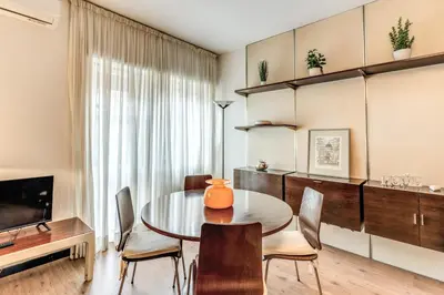 a dining room with a table and chairs at Zeus House in Rome