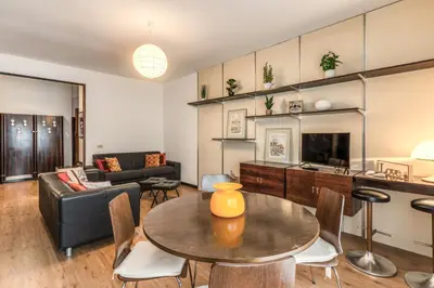 a living room with a table and a couch at Zeus House in Rome